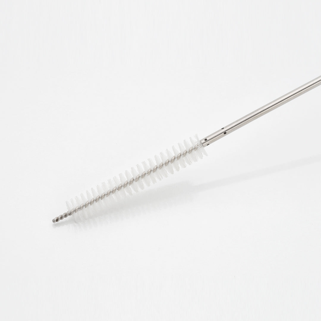 MIC cannula with adapter brush